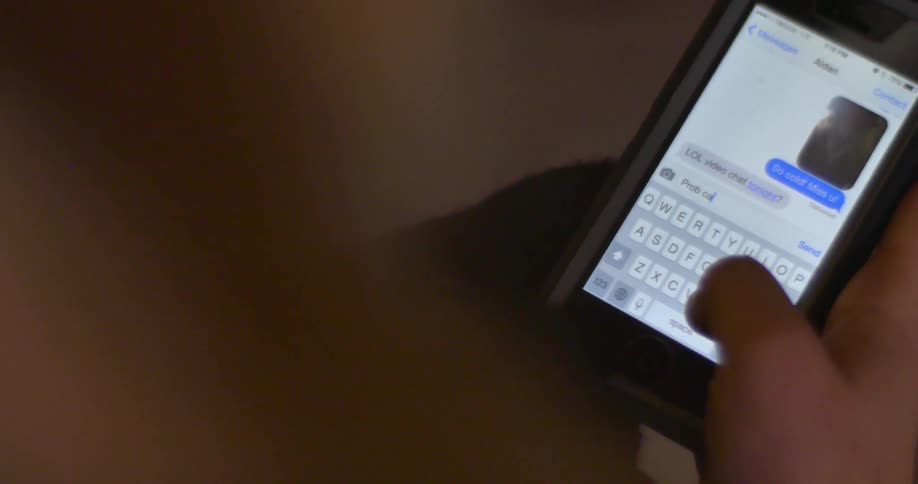 A person is texting on a phone
