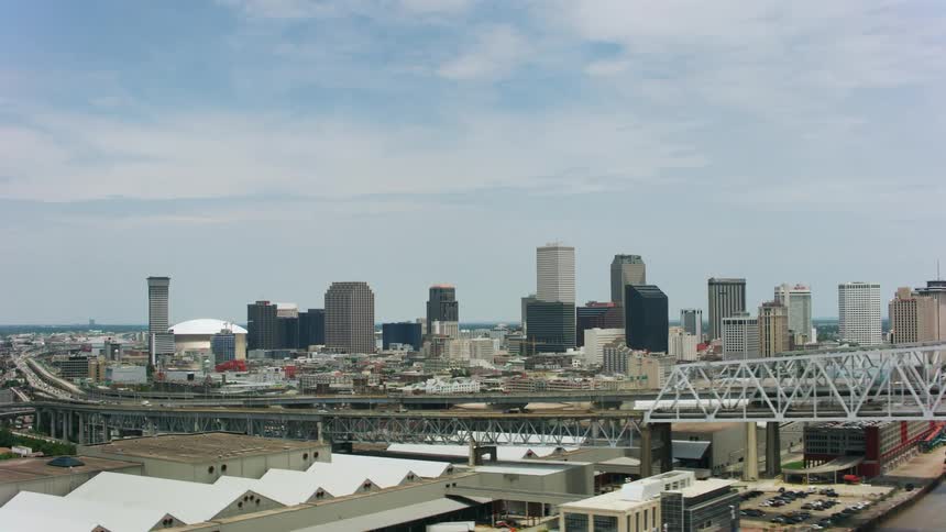 Aerial view of bridges over river and city skyline