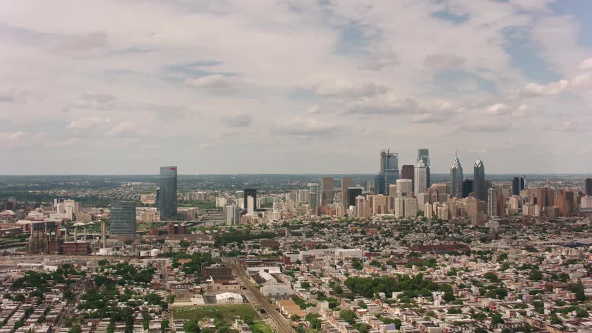 Skyscrapers loom over a metropolis during the day