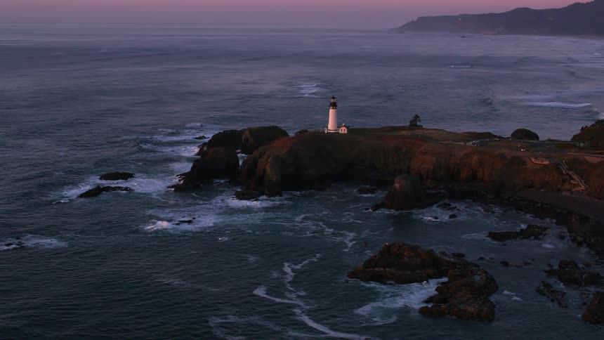 A lighthouse on headland on the ocean