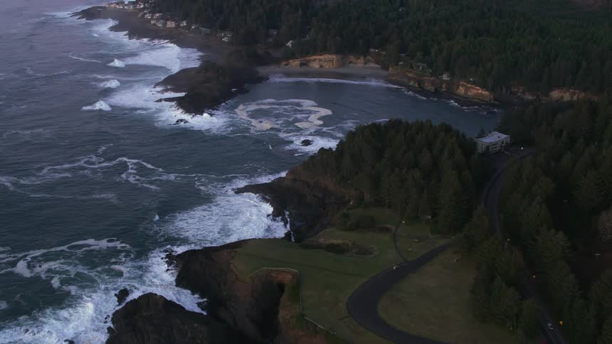 Aerial view of a hidden small cove on the coast next to the ocean