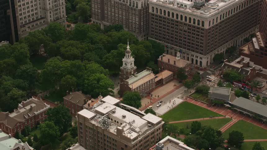 Aerial view of a church near a park in the middle of the city