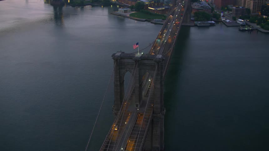 An aerial view of the brooklyn bridge and the coast near it
