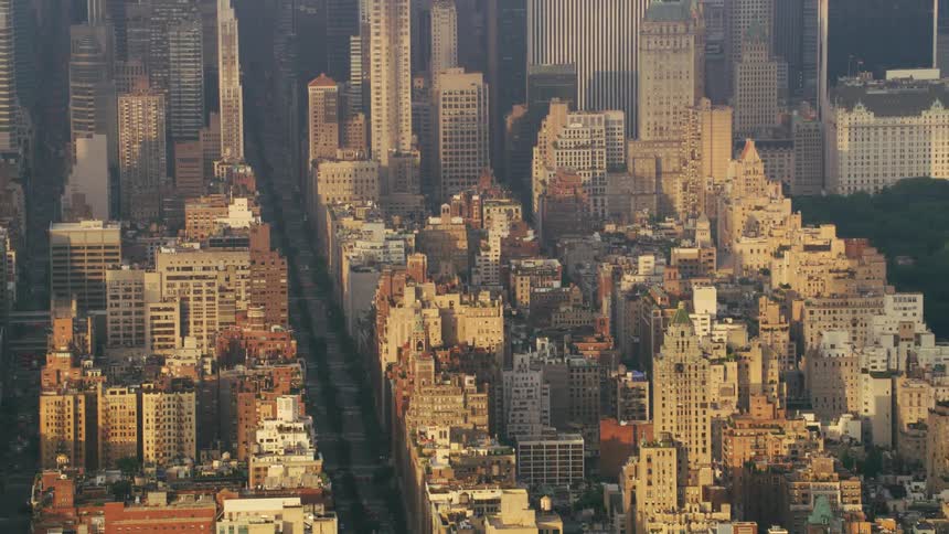 Aerial view of the buildings and streets on the city of new york at evening