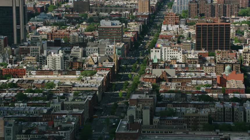 Aerial view of the streets and buildings on the city at morning