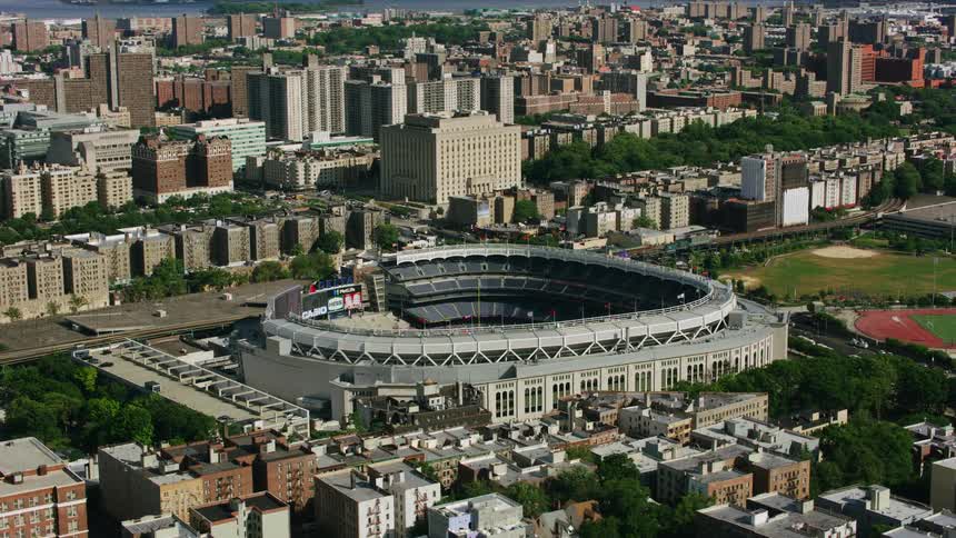 A baseball stadium sits near downtown surrounded by neighborhoods