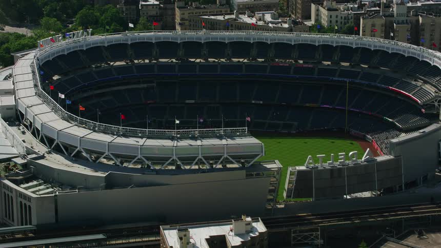 Aerial veiw of a baseball stadium in the city at daytime