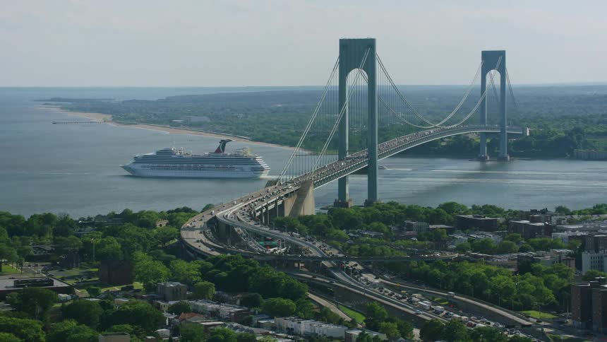 Vehicles travel across a bridge along a peninsula