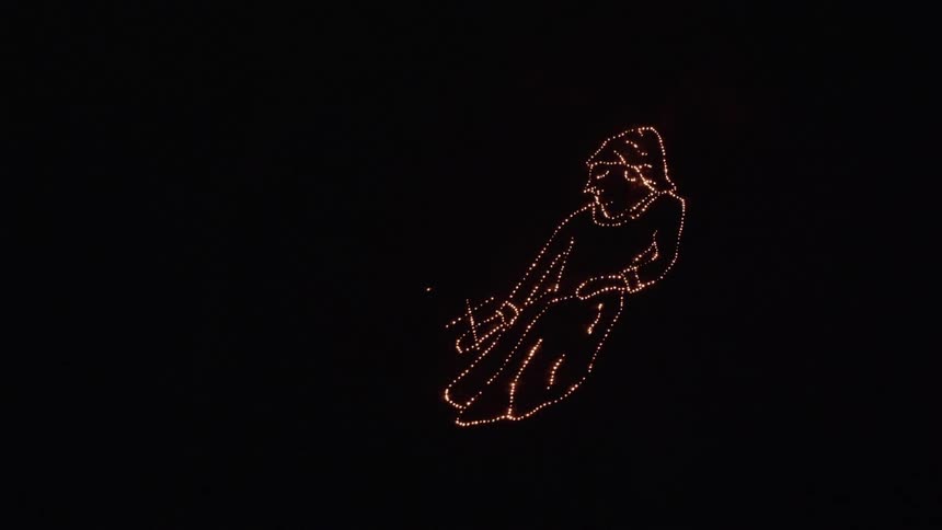 An aerial shot of a light display of a saint