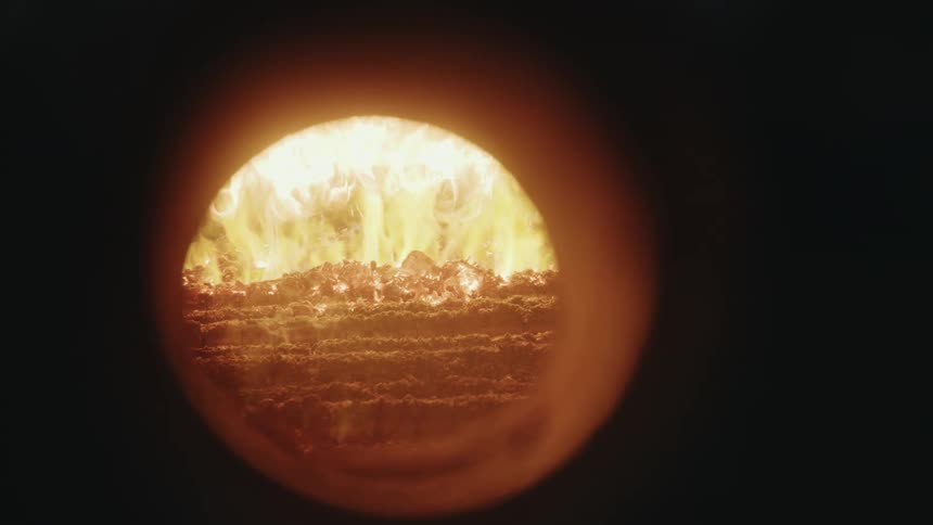 A window opens to reveal burning flames in a furnace