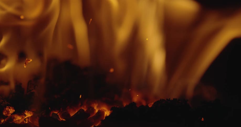 Ash flies up from burning coal in a fire
