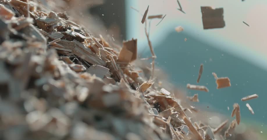 Close up of wooden chips falling