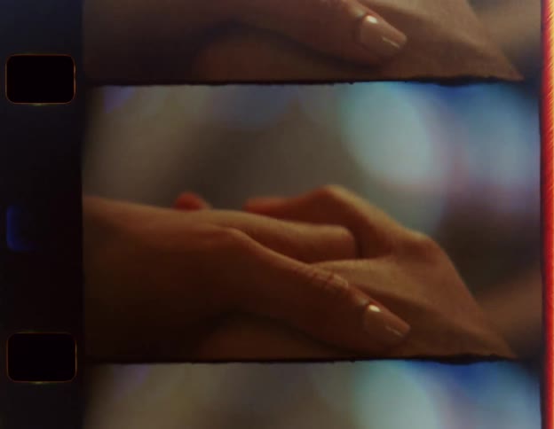 A man and a woman are holding hands