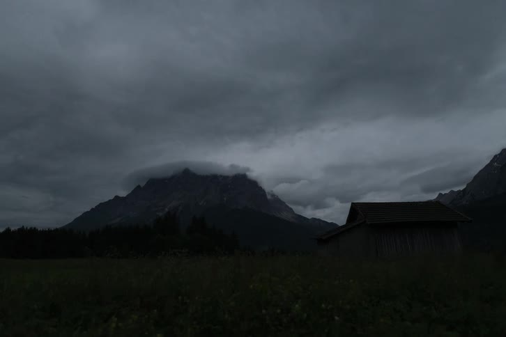 Landscape of clouds floating over field and mountain