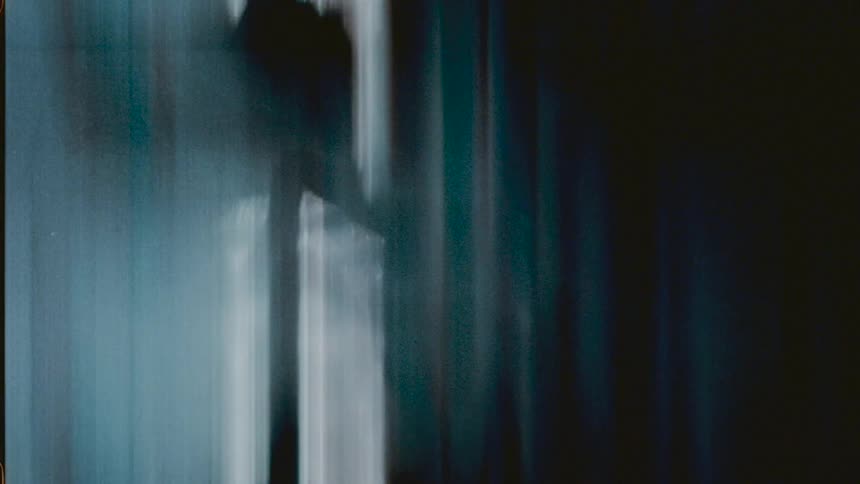 Muted colors form streaks that vibrate slightly