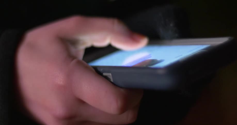 Person types a message on their cellular phone