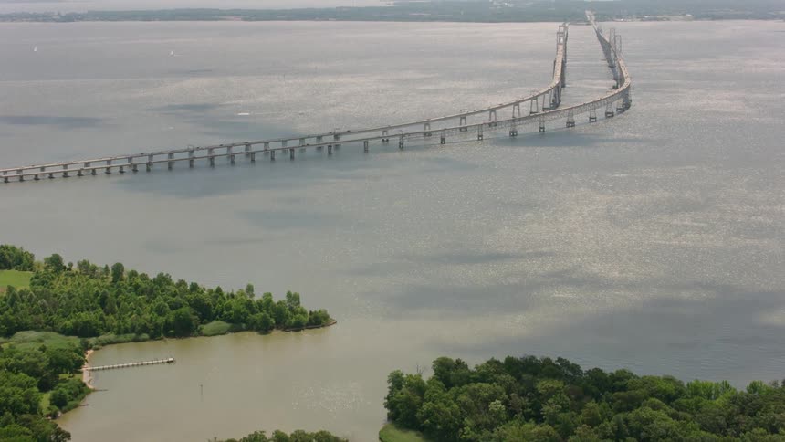 A long bridge connects land on a peninsula