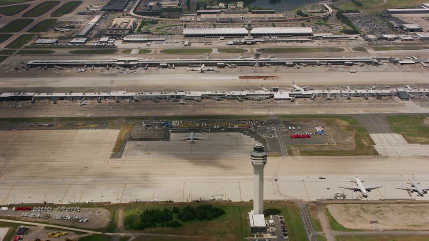 Passenger planes sit parked at an airport