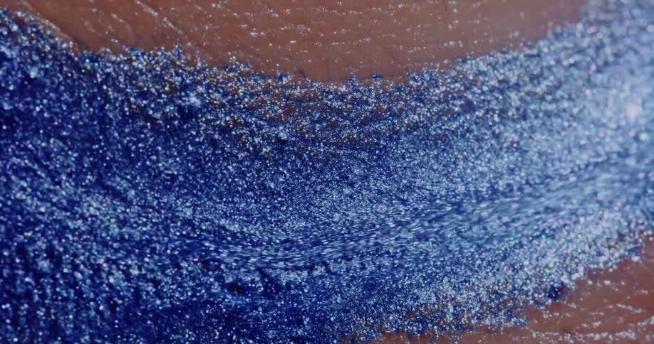 Glitter is washed away from human skin by water