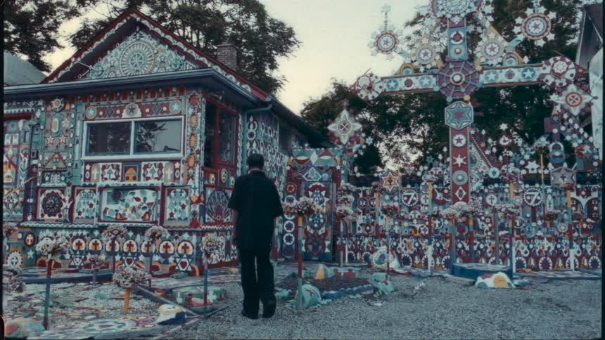 A man walks past a shrine