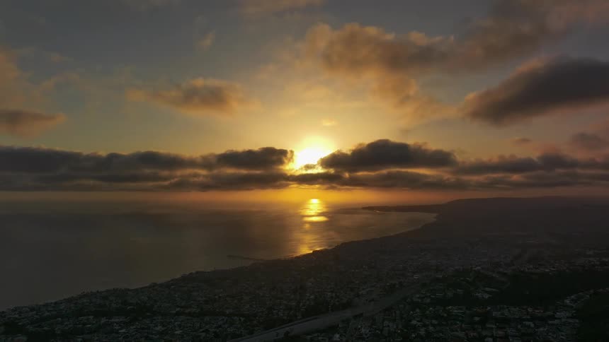 Timelapse of a sunset over a gravel beach