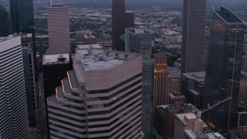 Drone view of a city center with tall skyscraper buildings in a metropolitan area