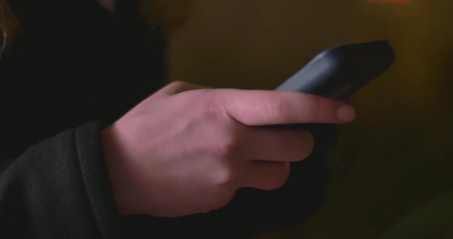 Person typing on their smartphone