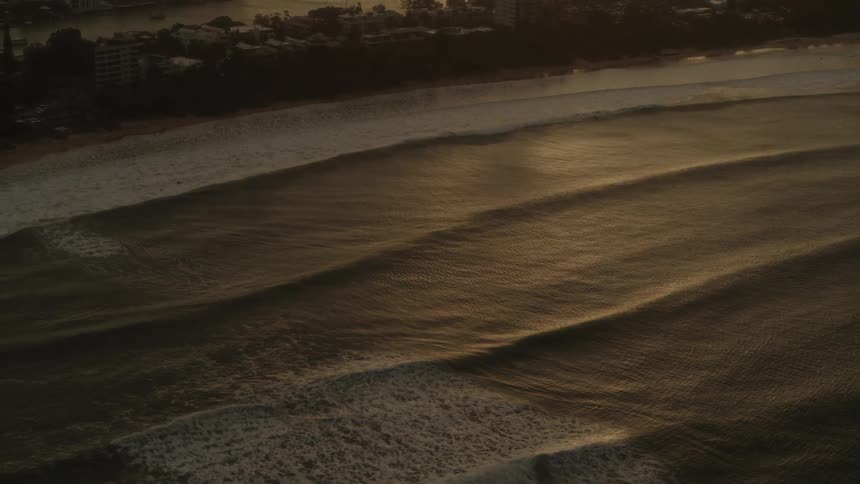 Gentle waves rock in the ocean off the coast