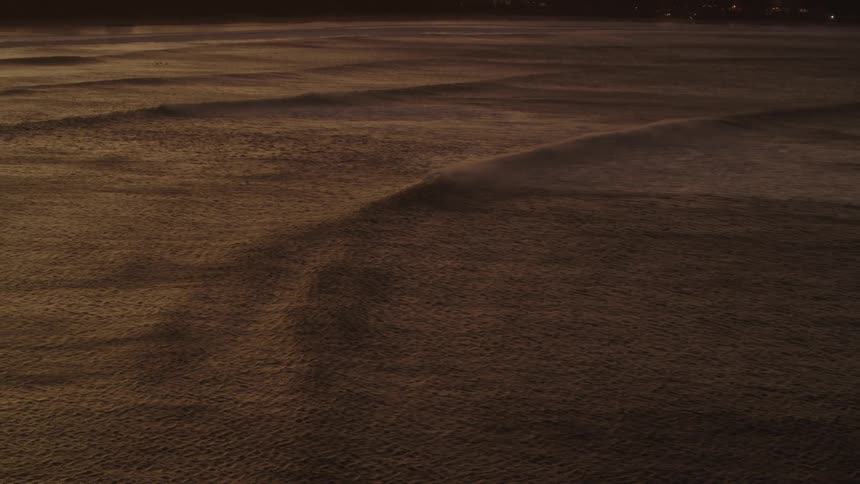 Aerial view of body of water at sunset