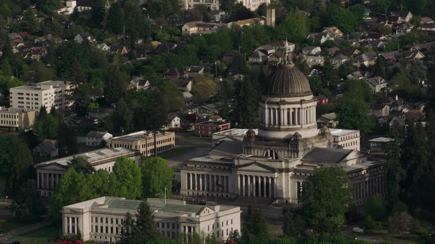 An aerial of a large government building in a suburban neighborhood