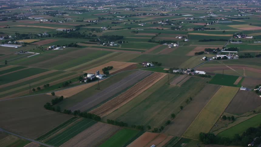Homes dot a rural landscape