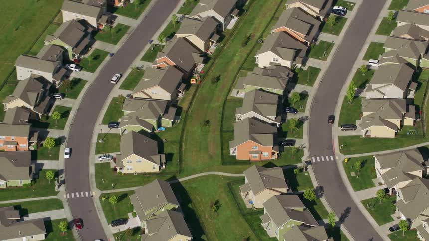 Homes sit in neat rows in a suburb