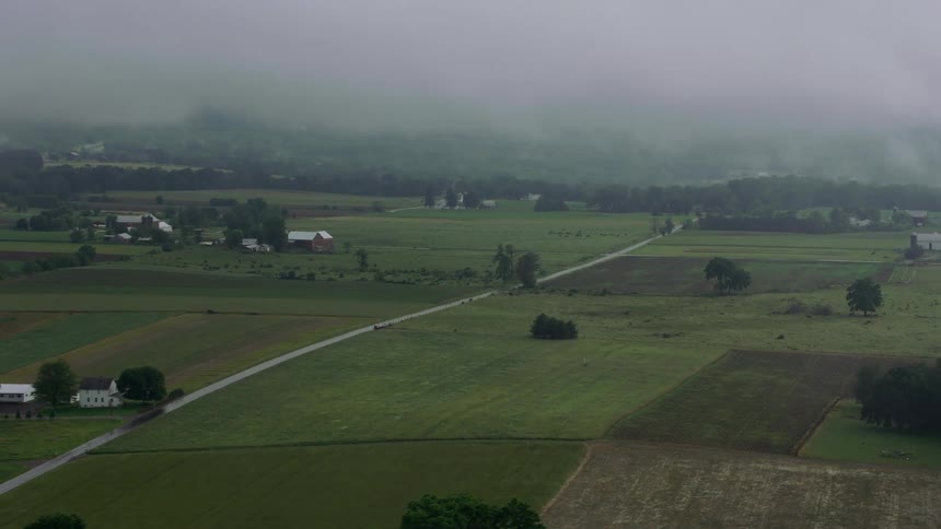Heavy smoke moves over rural homes in the countryside