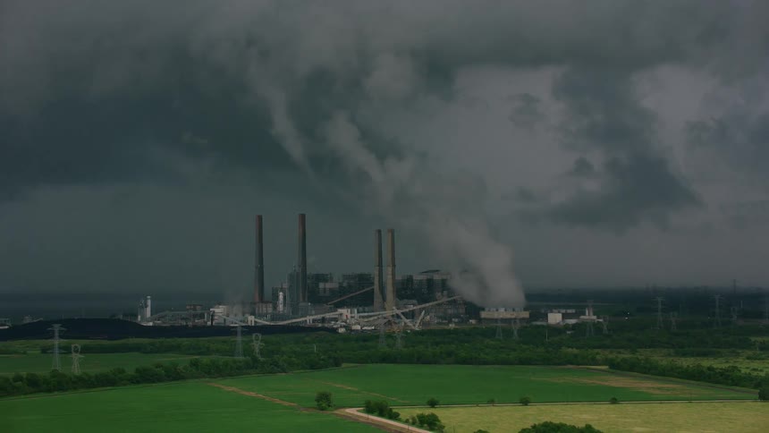 Smoke from a factory fills the sky with pollution
