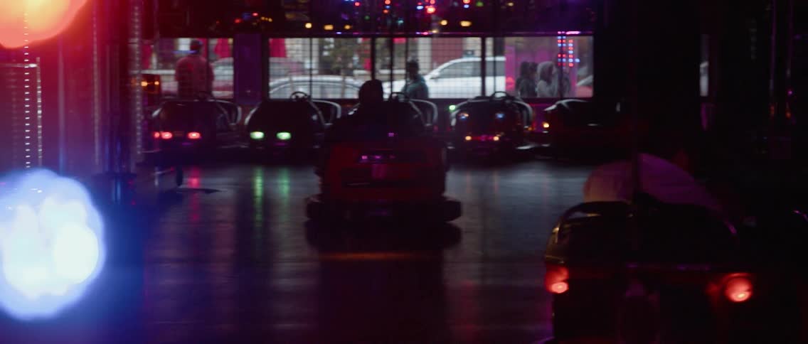 The people are having fun driving bumper cars