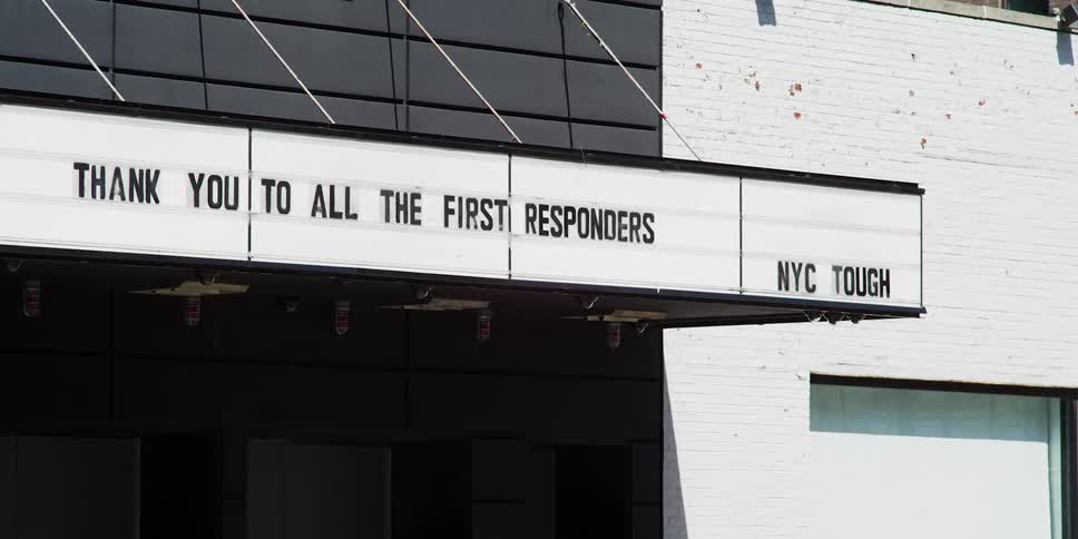 The sign says thank you on the building