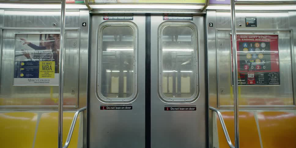 A subway train goes through an empty subway station