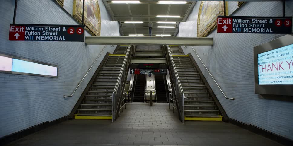 A staircase at a public transportation building is displayed
