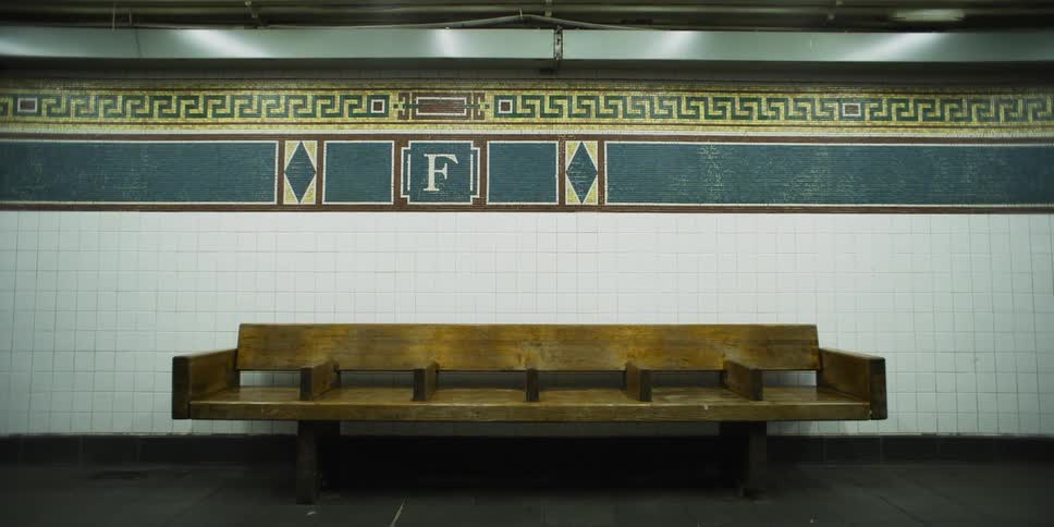 A wooden train station bench