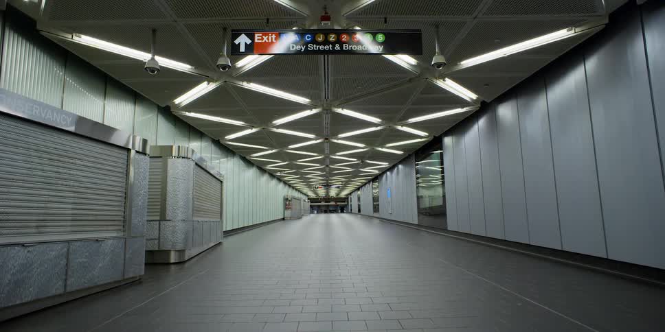 A train station with signs cameras and lights