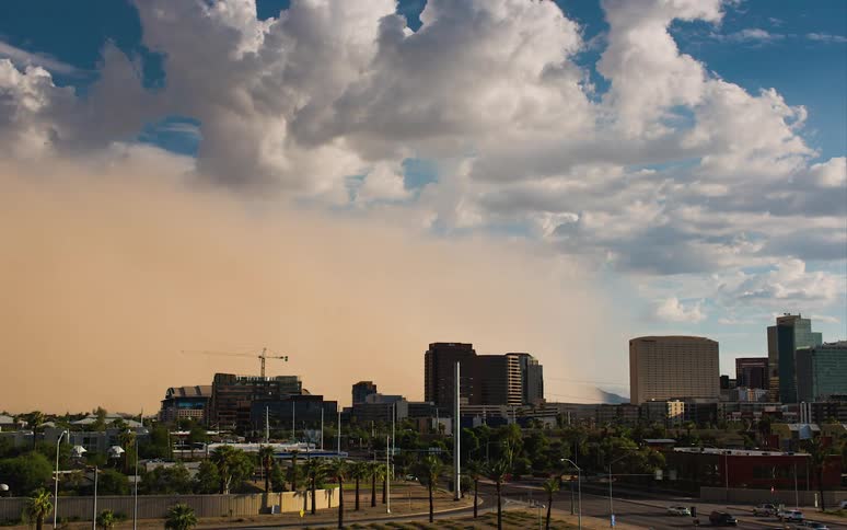 A dust storm rolls into a city
