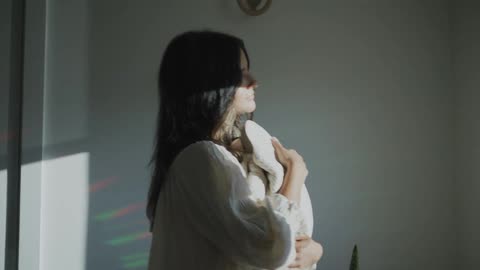 A mother holding her baby