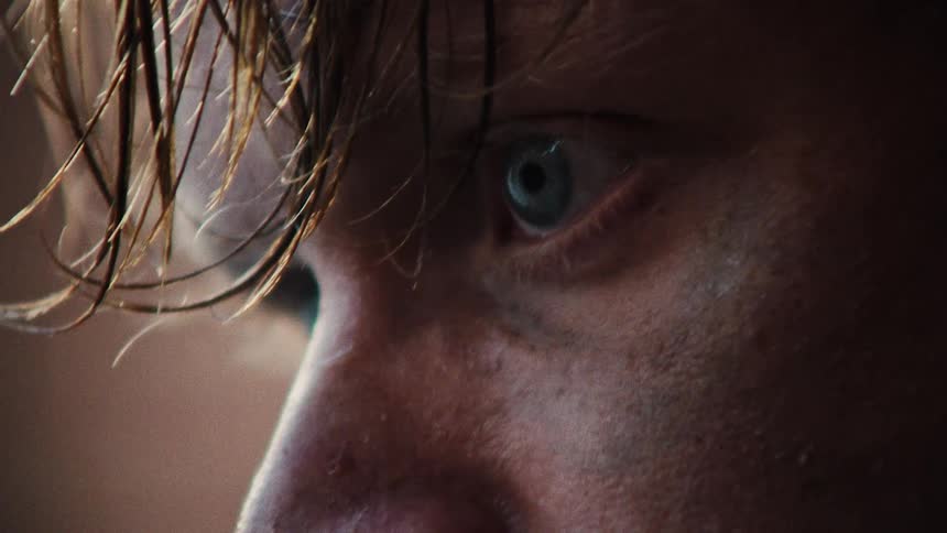 Close up view of a man with dirt on his face