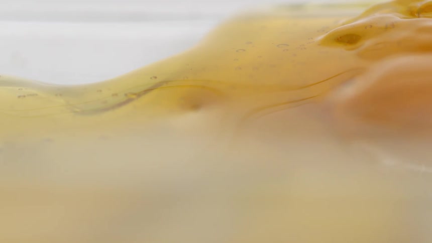 Golden syrup flows and melts into mass