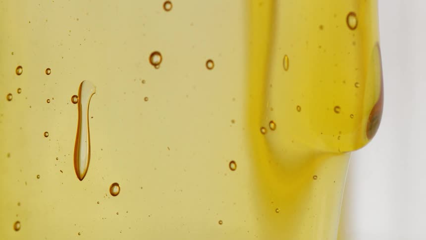 A view of liquid dripping down a cup