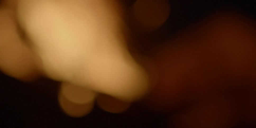 Unfocused flames burn in darkness