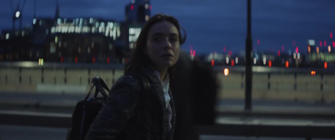 A determined woman walking through a busy street