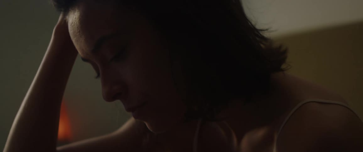 A woman yawns as she wakes up