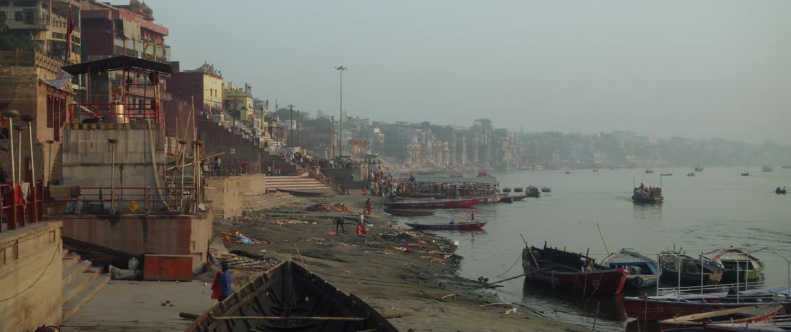 Boats docked on an indian city river