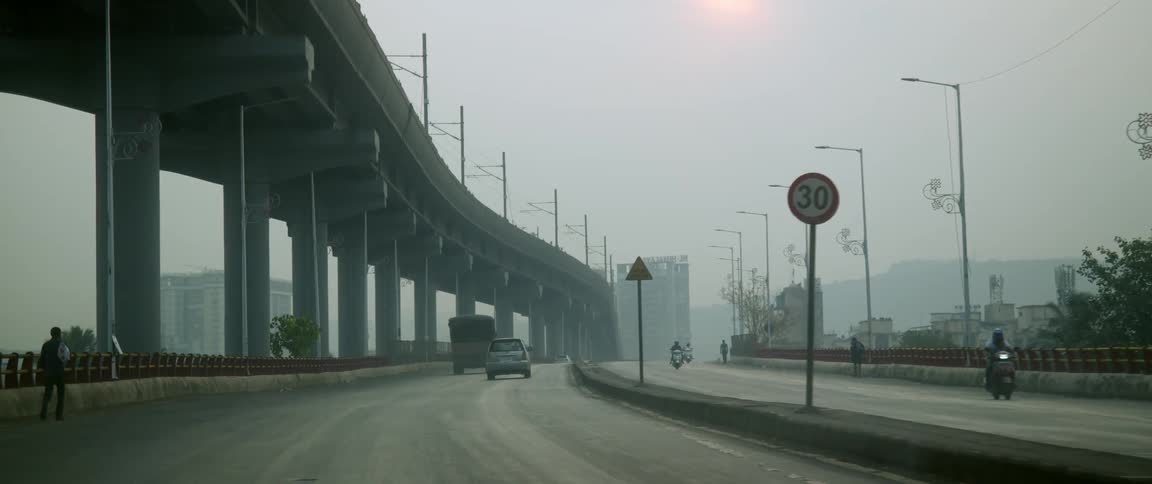 Vehicle drives along city highway